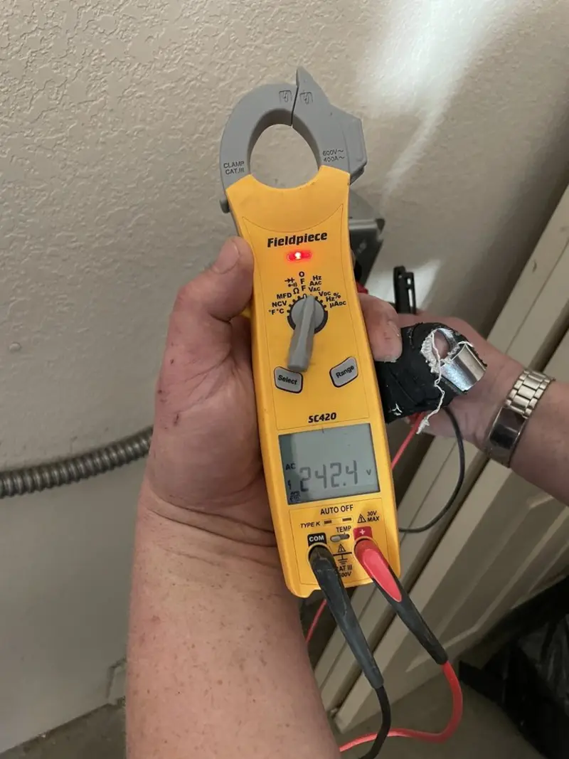 Voltage testing with clamp meter during Electrical Installation Services in Fruitport